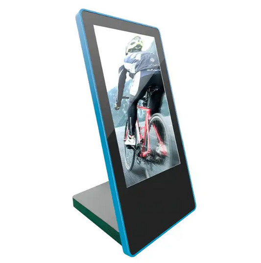 A countertop touchscreen kiosk with a black frame and blue accents, displaying an image of a person on a bicycle.